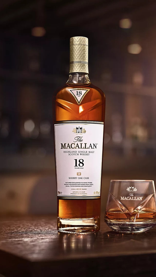 macallan 18 years old sherry oak bottle and glass in bar