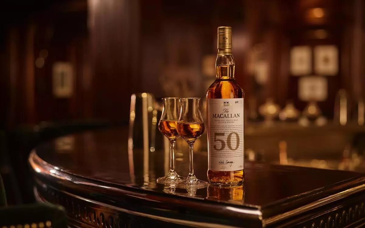 The Macallan 50 year old whisky and two drams in bar setting