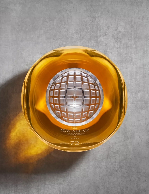 the macallan 72 years old whisky in lalique genesis decanter bottle top