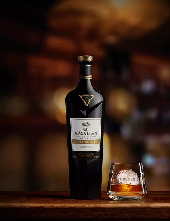 The Macallan Rare Cask Black whisky bottle and glass with whisky and ice