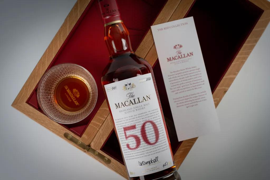 The Macallan red collection 50 year old whisky bottle and glass in box shot from above