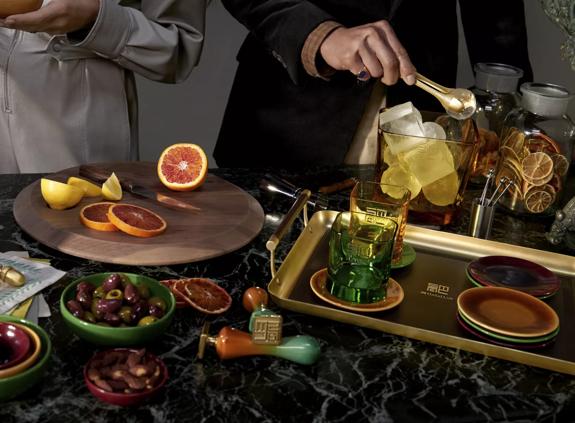The Macallan Harmony Collection Lifestyle Shot in Kitchen with Fruit and Glasses