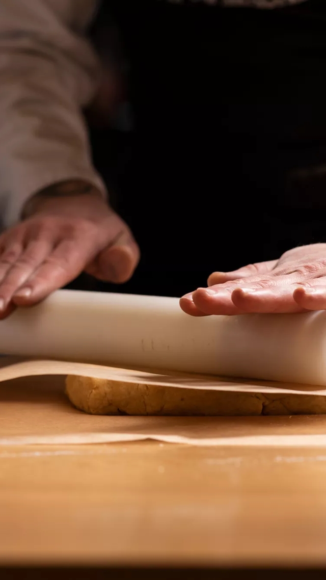 chef rolling dough