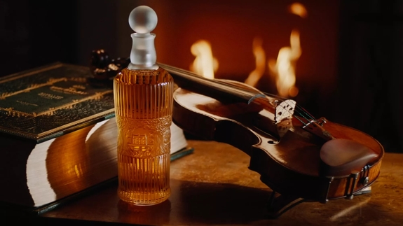 Tales of The Macallan Bottle of Whisky and Violin by Fireplace